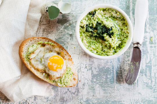 Fried quail egg, wild garlic butter and french bread