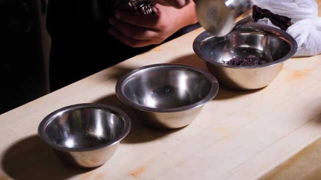 Close up cooking footage showing man adding measured hibiscus for chamoy recipe during a homemade chamoy sauce recipe prepared from scratch