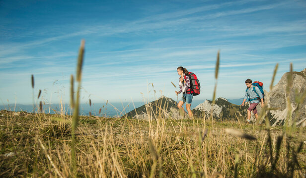 Austria, Tyrol, Tannheimer Tal, young couple hiking