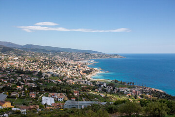 Fototapeta premium Scenic Seaside Landscape with Blue Water and Distant Hills