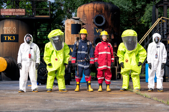 Emergency response workers in chemical protective suits during a hazardous materials training exercise