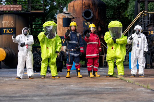 Emergency response workers in chemical protective suits during a hazardous materials training exercise