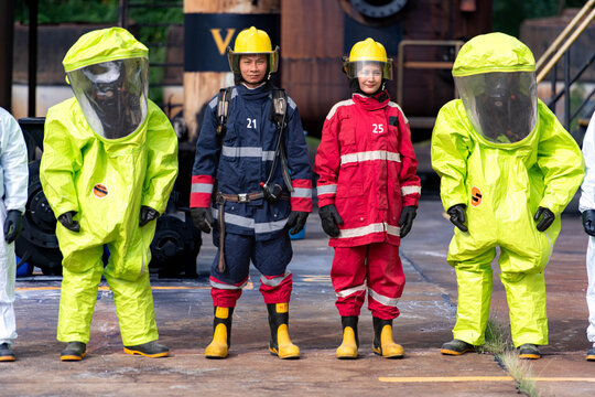 Emergency response workers in chemical protective suits during a hazardous materials training exercise