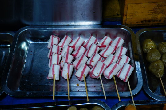 Red and White Skewered Fish Cake at a Food Stall