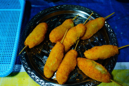 Crispy Fried Skewered Snacks Served on a Plate