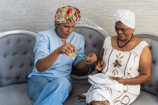 Multigenerational women sharing beading and embroidery craft
