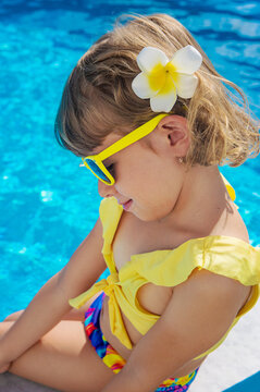 A child resting near a pool. Selective focus.