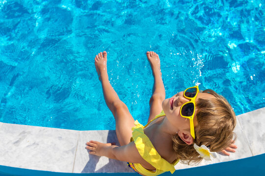 A child resting near a pool. Selective focus.