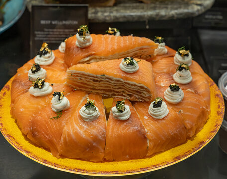 Smoked salmon crepe cake features delicate thin cr&ecirc;pes or pastry layers filled with cream cheese, cream, and smoked salmon.