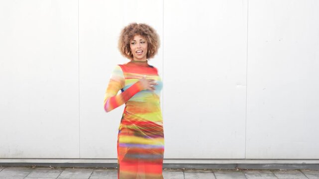 Vibrant and EyeCatching Fashion Model in a Colorful Dress Posing Elegantly and Gracefully