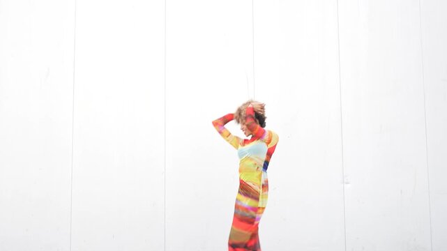 Vibrant and Fashion Forward Colorful Dress Worn by Model Showcased Against a Neutral Background