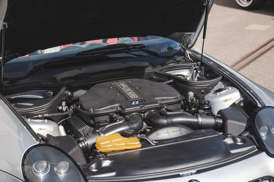 Lindau, Switzerland, August 9, 2026. Wide perspective view of open engine bay on silver BMW Z8 sports car showing V8 engine.