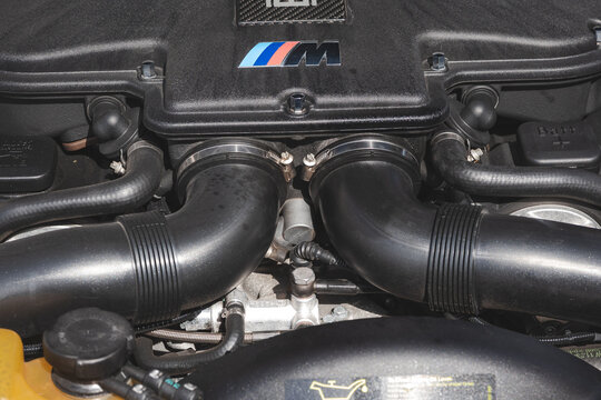 Lindau, Switzerland, August 9, 2026. Close up shot of dual intake pipes and BMW M emblem inside Z8 sports car engine bay.