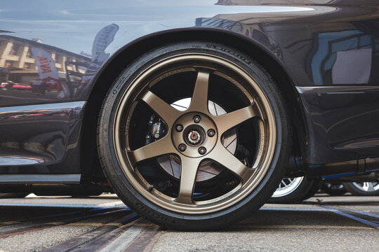 Lindau, Switzerland, August 9, 2026. Close up view of bronze Volk Racing TE37 wheel and Brembo brake on sports car.