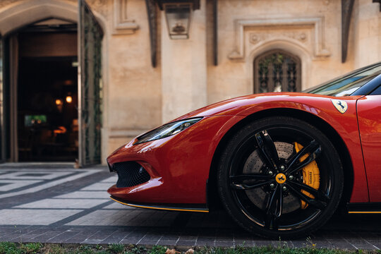 Ferrari 296 at the parking of modern hotel