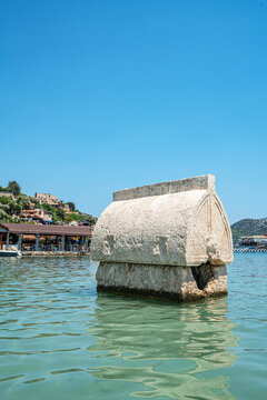 Turquoise waters and ancient Lycian coast of Kekova Island during a boat cruise in Antalya, Turkey.