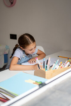 Girl Doing Homework at Her Desk