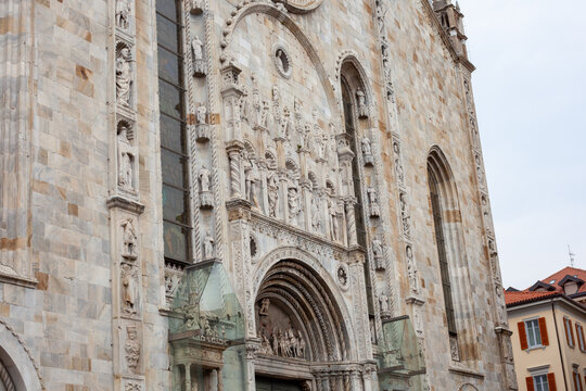 Old Church in Italy Como Cathedral Duomo Italian old temple in center. Santa Maria Assunta square. Como city center house building architecture. Street wall entrance facade.