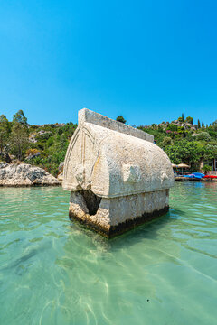 Turquoise waters and ancient Lycian coast of Kekova Island during a boat cruise in Antalya, Turkey.