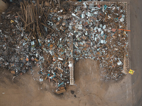Aerial view of Agnesberg scrap metal yard with piles of assorted metal, scrap, and industrial waste in Gothenburg, Vastra Gotaland County, Sweden.