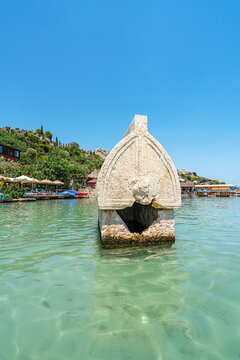 Turquoise waters and ancient Lycian coast of Kekova Island during a boat cruise in Antalya, Turkey.