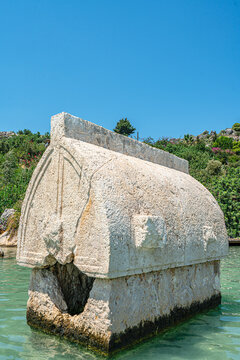 Turquoise waters and ancient Lycian coast of Kekova Island during a boat cruise in Antalya, Turkey.