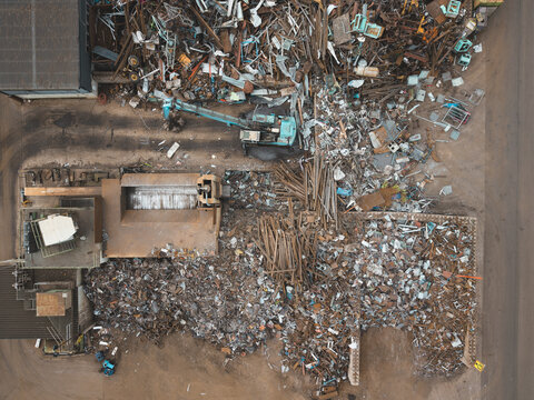 Aerial view of the scrap metal recycling facility in Agnesberg with piles of industrial waste and machinery in Gothenburg, Vastra Gotaland County, Sweden.