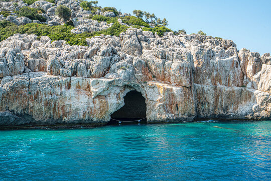 Turquoise waters and ancient Lycian coast of Kekova Island during a boat cruise in Antalya, Turkey.