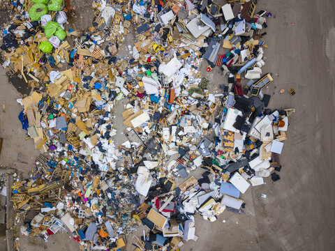 Aerial view of a large pile of mixed waste and discarded materials at a recycling facility in Agnesberg, Gothenburg, Vastra Gotaland County, Sweden.