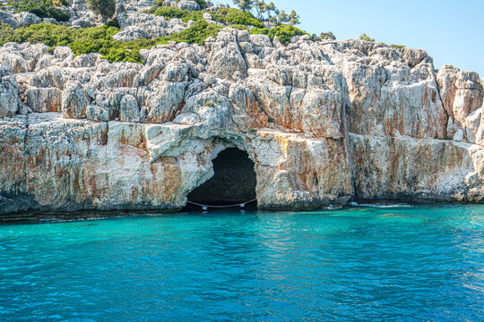 Turquoise waters and ancient Lycian coast of Kekova Island during a boat cruise in Antalya, Turkey.