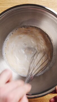 Dry yeast and sugar are whisked into warm mixture, making milk bread. Milk bread bakes with soft crumb, airy texture and golden crust. Shape milk bread dough into loaf, dinner rolls, toast or buns.