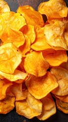 Naklejka premium Close-Up of Vibrant Orange Dried Persimmon Slices Creating a Textured and Colorful Background for Culinary and Health-Themed Projects