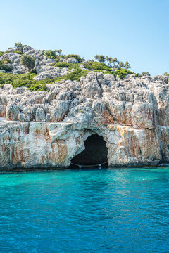 Turquoise waters and ancient Lycian coast of Kekova Island during a boat cruise in Antalya, Turkey.