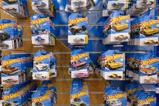 Saint-Petersburg, Russia - 8 June 2026. Rows of iconic Hot Wheels blister packs create a dynamic retail display; bold colors, glossy finishes, and classic car silhouettes celebrate automotive nostalgi
