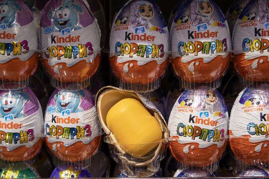 Saint-Petersburg, Russia - 8 June 2026. Kinder Surprise eggs with a cracked shell revealing the iconic yellow capsule