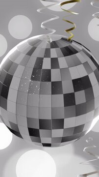 Animation of party streamers and mirror disco ball on grey background