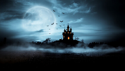 Fototapeta premium Halloween night scene with a dark castle perched on a fog-shrouded hill. The soothing light of a large full moon amidst a night sky with scattered clouds.