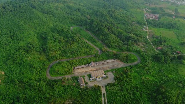 Aerial view of Kalan Circuit surrounded by dense tropical forest in Samarinda, East Kalimantan, Indonesia.