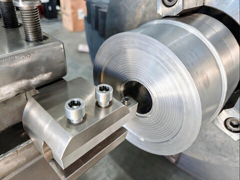 Close Up Machined Steel Cylinder on Lathe