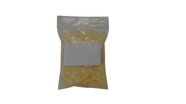 Small plastic bag filled with raw yellow rice grains for cooking or food storage isolated on transparent background