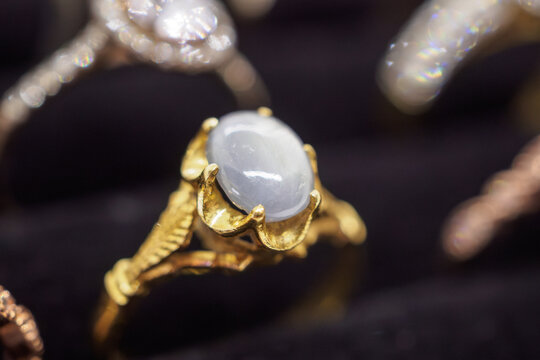 Vintage gold jewelry blue sapphire rings show in luxury retail store display showcase