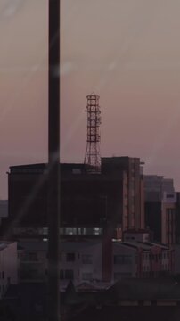 Animation of data processing, world map and spinning globe against aerial view of cityscape