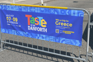 Fototapeta premium barrier fence and banner at TOTD 2026, community-based street festival, Toronto
