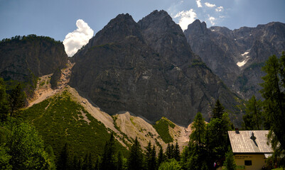 Koca na Gozdu alpine hut at 1226 meters beneath Mount Prisank wall in Triglav National Park. © YuliiaKettu