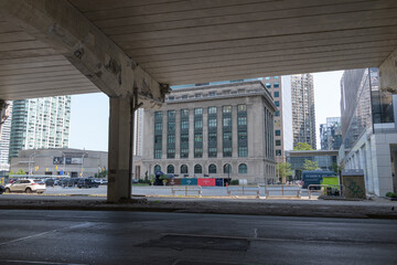 Fototapeta premium under-the-elevated-Gardiner Expressway view of Toronto Harbour Commission Building, completed in 1917, designed by Chapman & McGiffin in the Beaux-Arts style (north elevation)