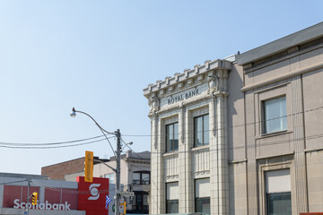 Fototapeta premium distant view of RBC Royal Bank (650 Danforth Av) and Scotiabank (649 Danforth Av) in Greek Town, Toronto