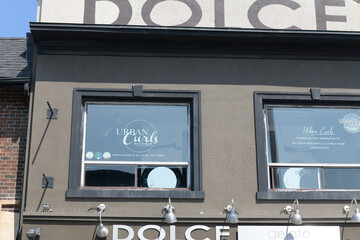 Fototapeta premium exterior building facade and signage of Dolce Gelato, an ice cream shop, located at 414 Danforth Av, Toronto