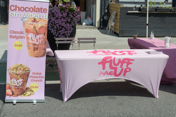 Fototapeta premium table outside Fluff Me Up, a coffee shop, located at 800 Danforth Av, during the Taste on the Danforth event 2026, Toronto