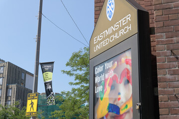 Fototapeta premium announcement board at East End United and pole-mounted banner of Danforth BIA, Toronto