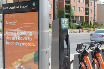 Fototapeta premium Bike Share Toronto docking station at Laird Crosstown Station